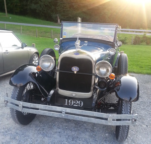 A blue antique car.